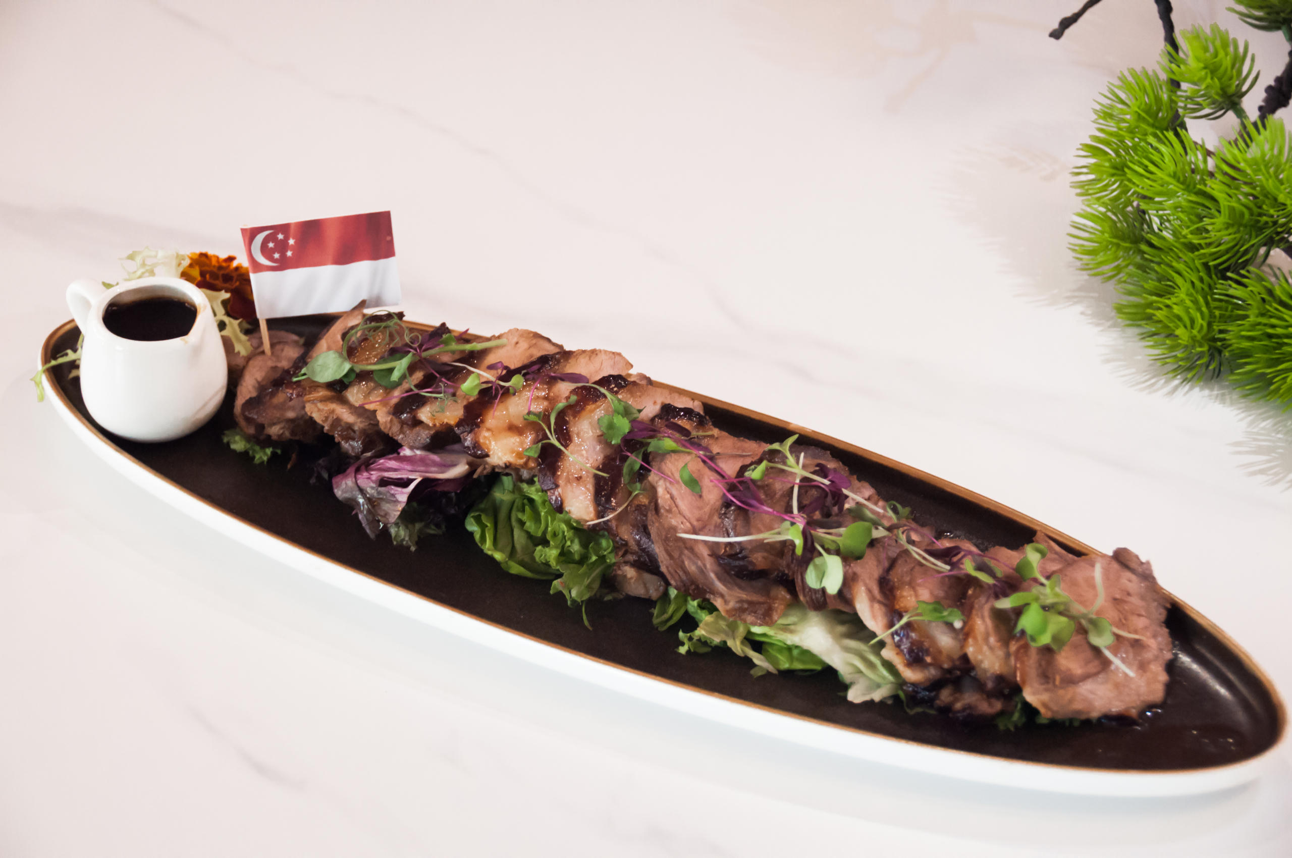 Roast Lamb Shoulder with Black Peppercorn Sauce at Mansion 7